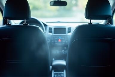 Car interior being treated for odor removal process